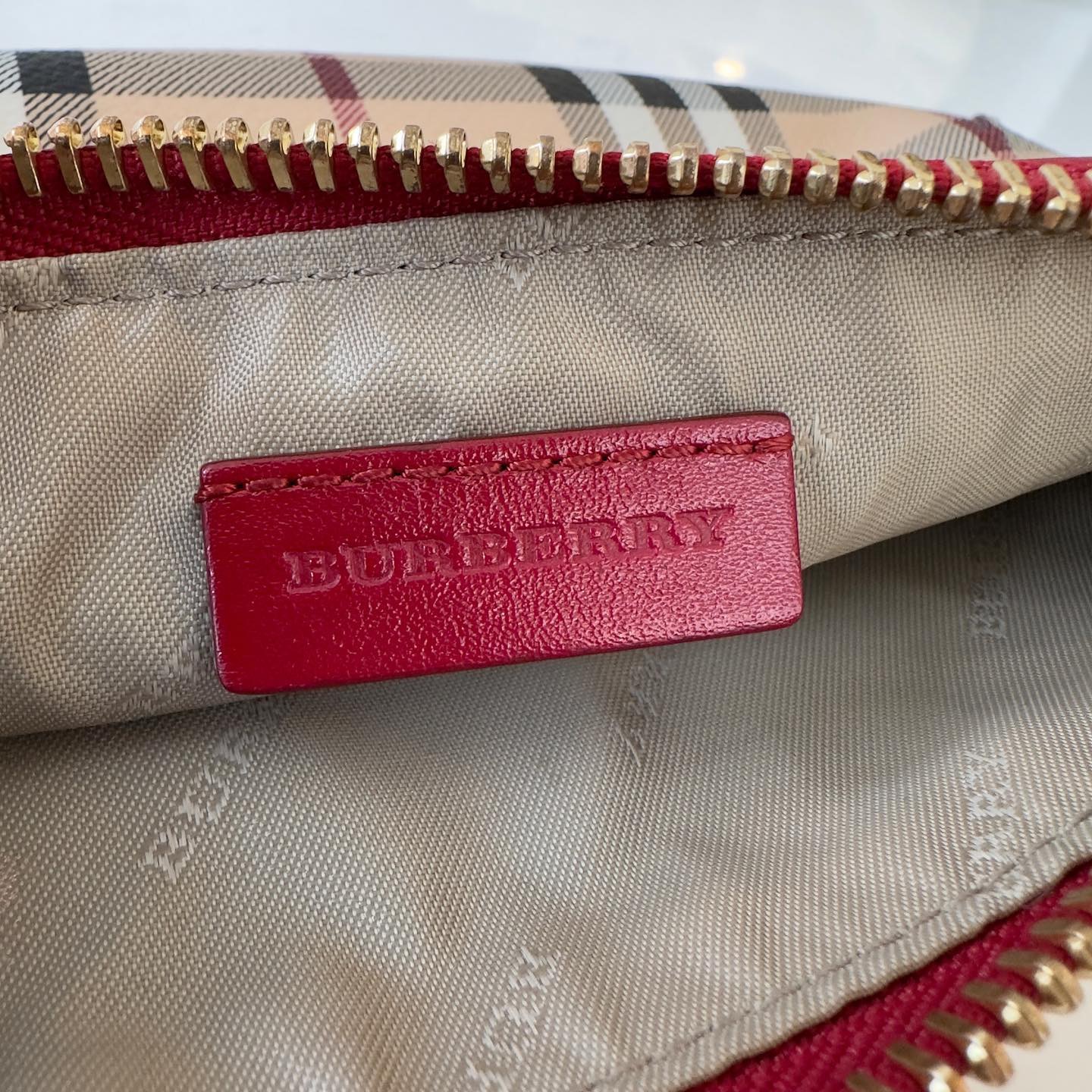 Pochette Burberry in tela plastificata (check vintage) e finiture